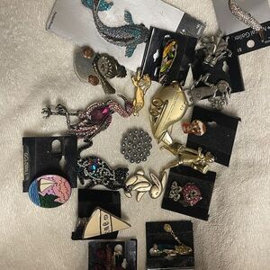 Elegant Silver and Gold Brooch Collection